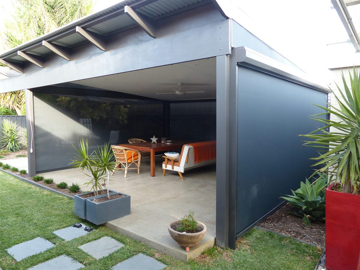 Exterior solar shade on a covered backyard patio
