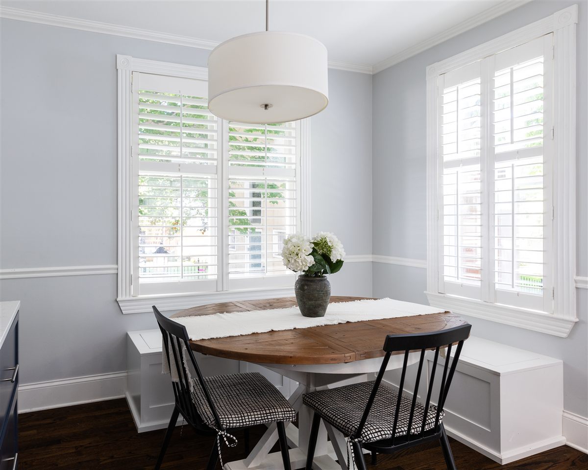 White plantation shutters in a breakfast nook