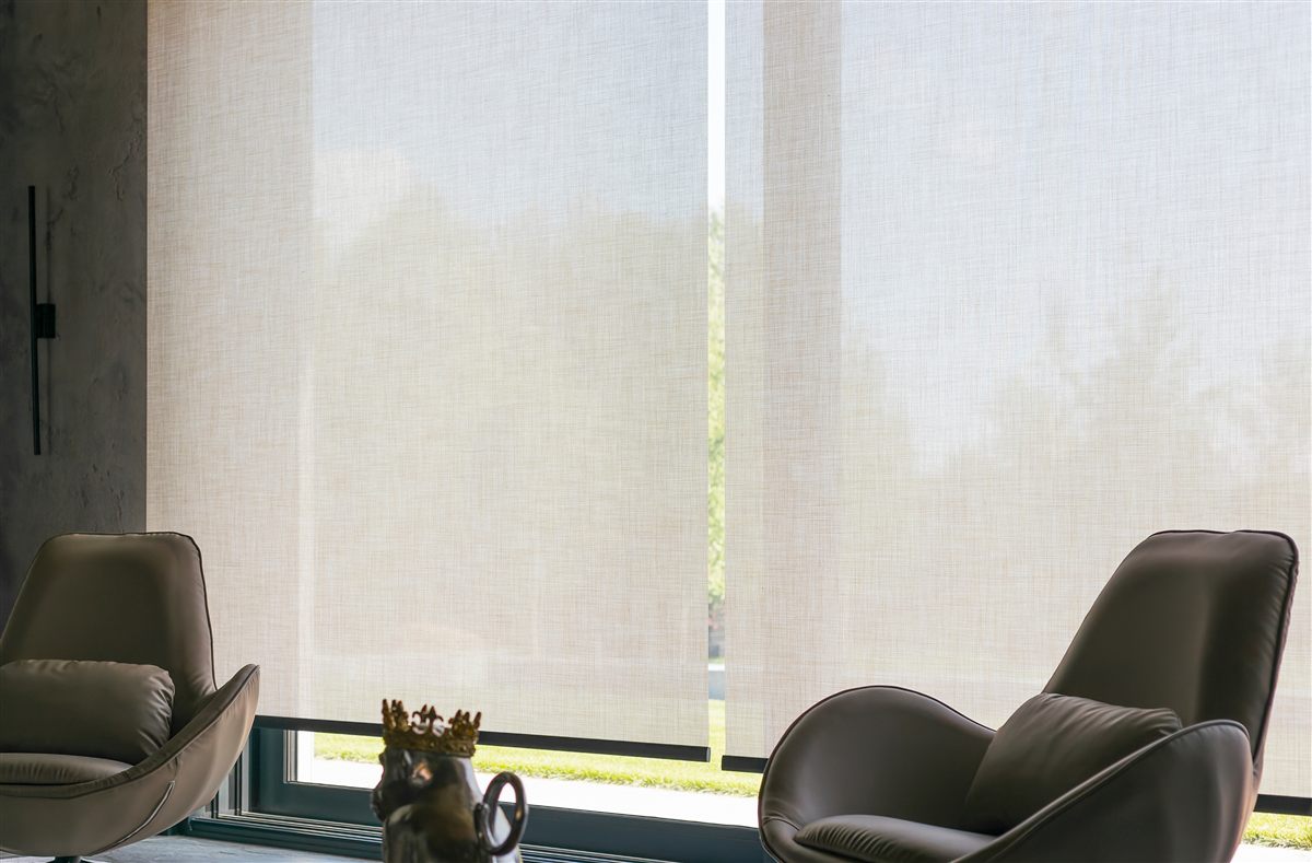 Light-filtering roller shade in a modern living room
